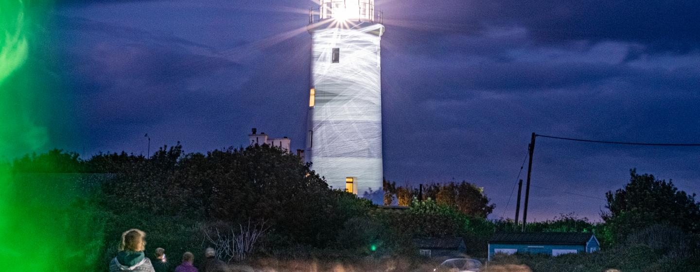 An image of a lighthouse shining