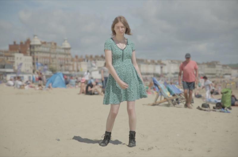 Girl standing on Weymouth beach
