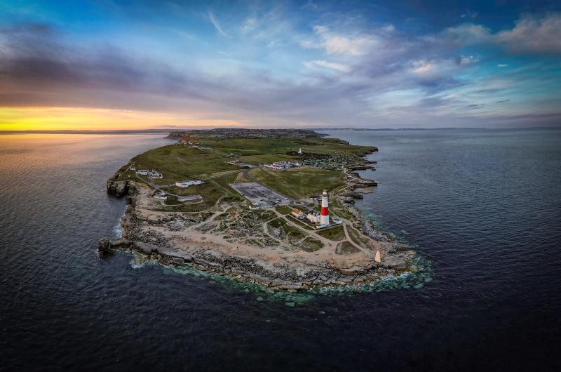 A colour photo of the isle of Portland taken from the air