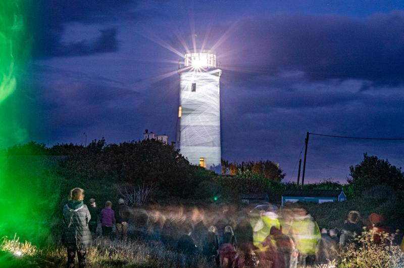 An image of a lighthouse shining