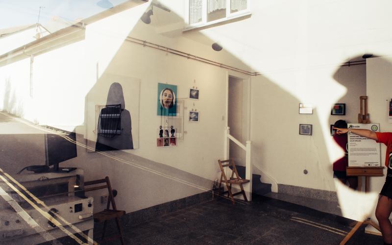 An image of an exhibition taken through a window.