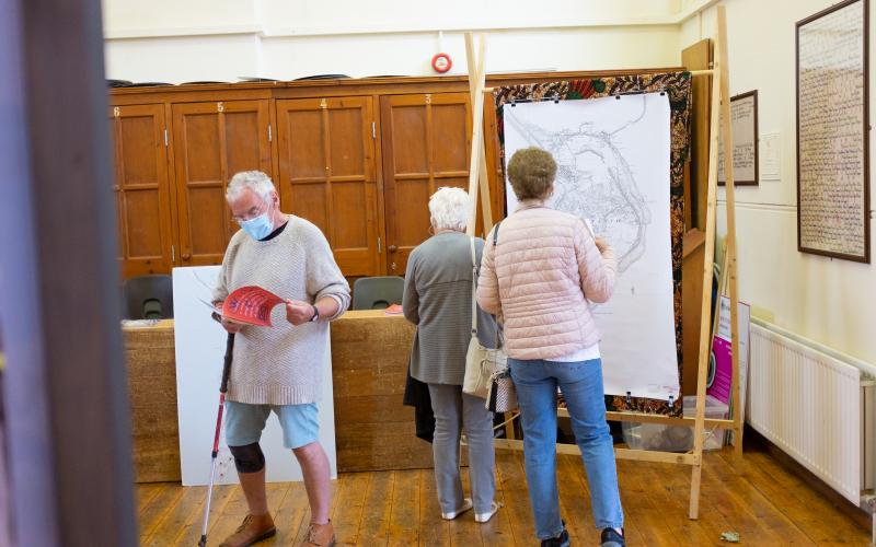 People looking at a map in the b-side Festival Hub