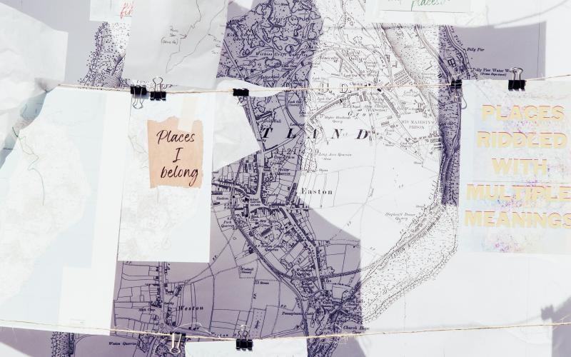A map with paper attached to string in front