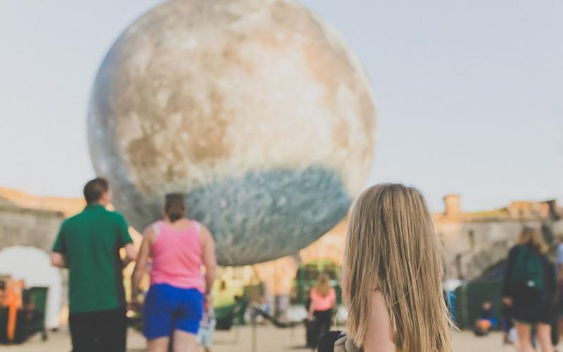 Picture of a girl looking at Museum of the Moon