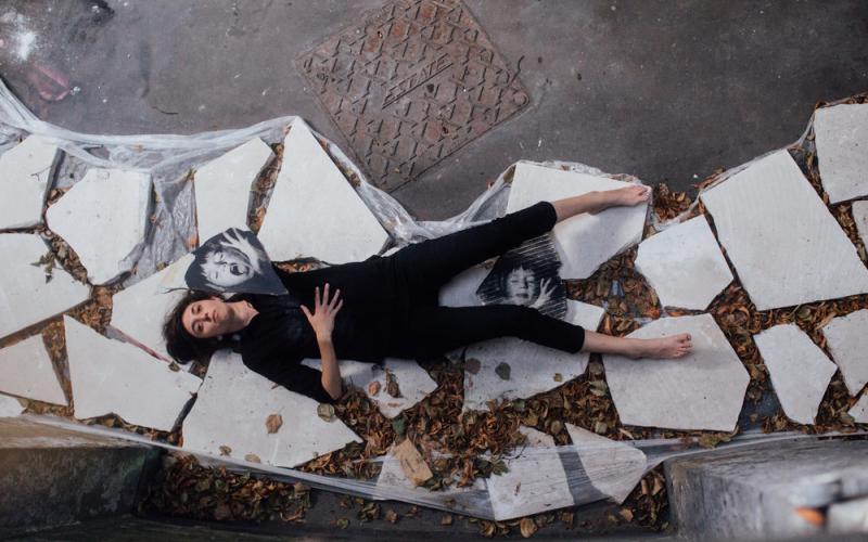 Woman lying on stones